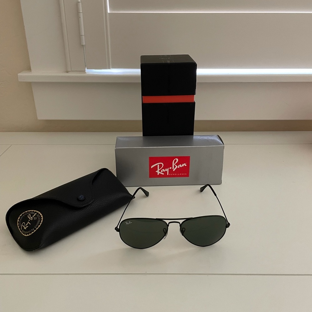 Ray-Ban Aviators in black.